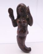 A small, possibly 17th/18th century, wooden carving of a mermaid. 5.5 cm high.