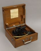 A W Ludolph German sextant with fitted binoculars, cased. The case 33 cm wide.