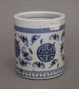 A Chinese blue and white porcelain brush pot. 12 cm high.