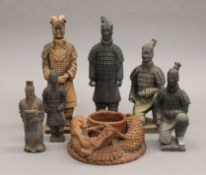 Six terracotta army model figures and a terracotta vase decorated with dragons.