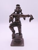 A small Indian bronze god figure. 10 cm high.