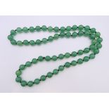 A bead necklace. 70 cm long.