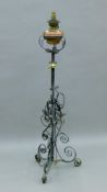 A Victorian Arts and Crafts standard lamp. 139 cm high.