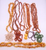 A quantity of amber necklaces, etc.