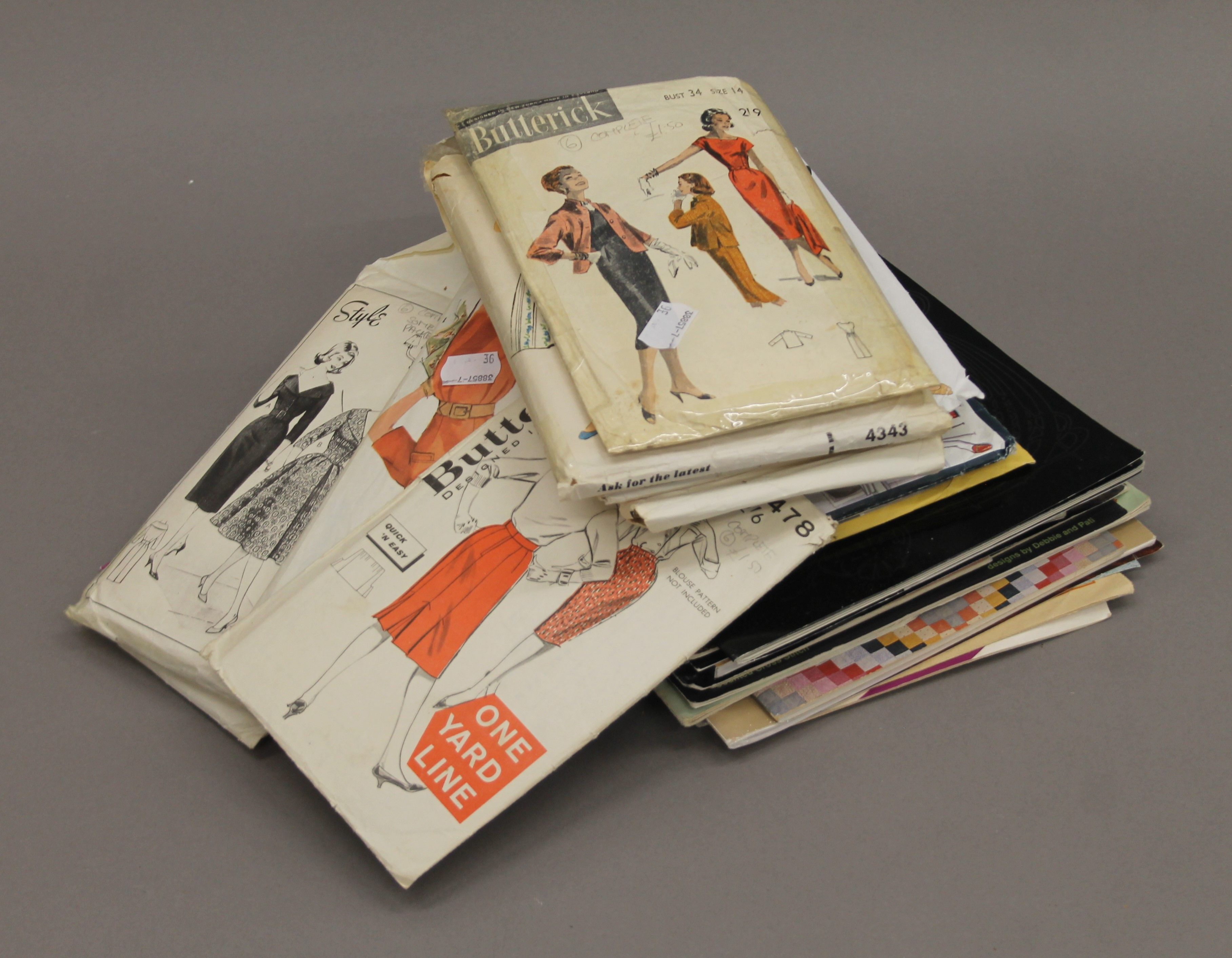 A quantity of vintage sewing patterns, etc.