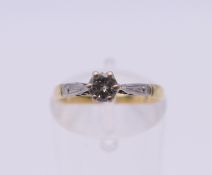 An 18 ct gold diamond solitaire ring. Ring size J. 2 grammes total weight.