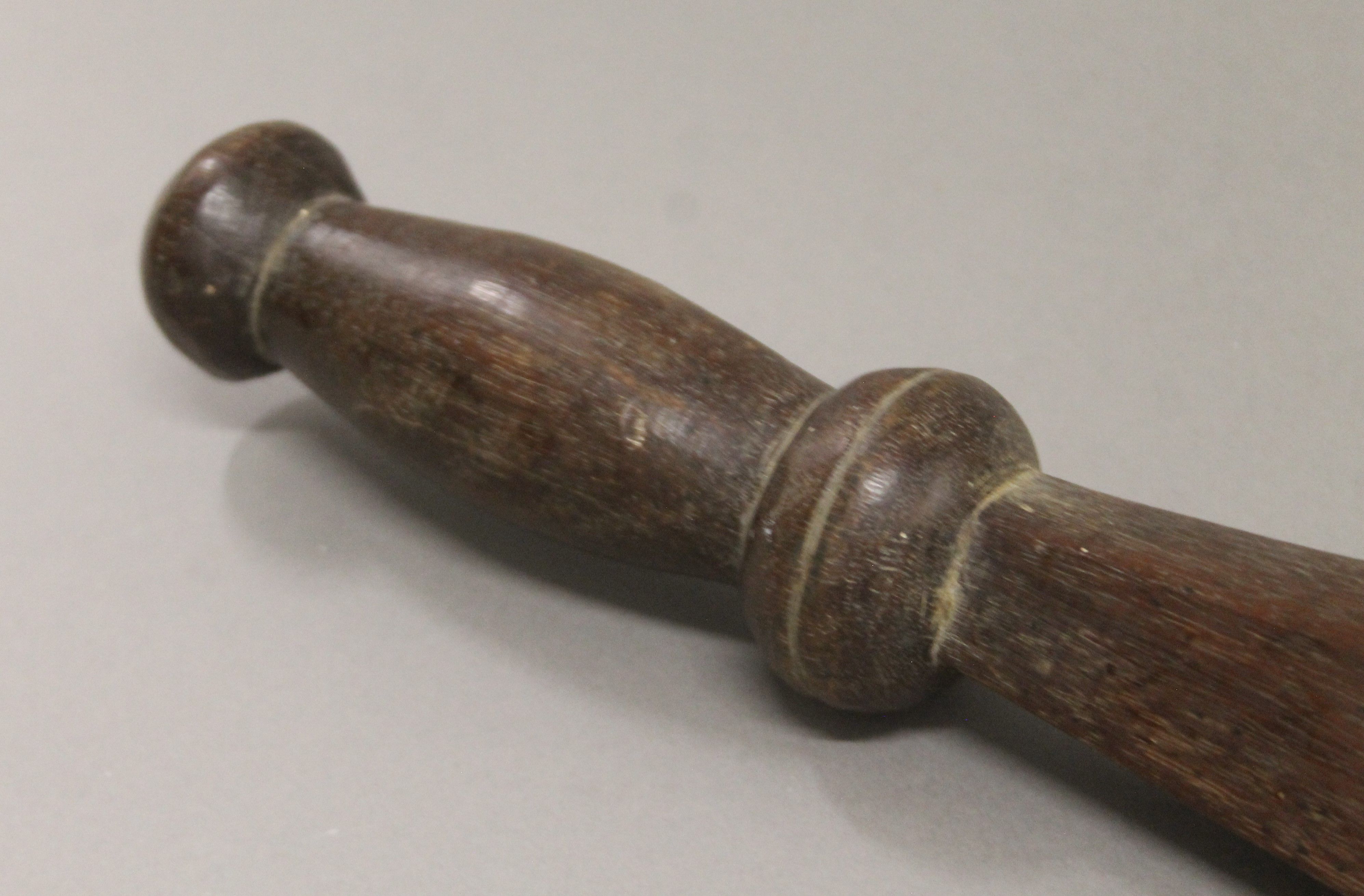 A tribal wooden sword form club, possibly South Seas. 51 cm long. - Image 2 of 3