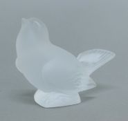 A Lalique France glass model of a bird. 8.5 cm high.