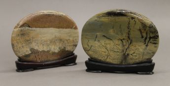 A pair of Chinese scholar's rock studies, on wooden bases. Each 11.5 cm high.