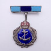 An enamelled Naval brooch, stamped solid silver. 4 cm high.
