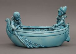 A 19th century Continental porcelain vase formed as a boat. 31 cm long.