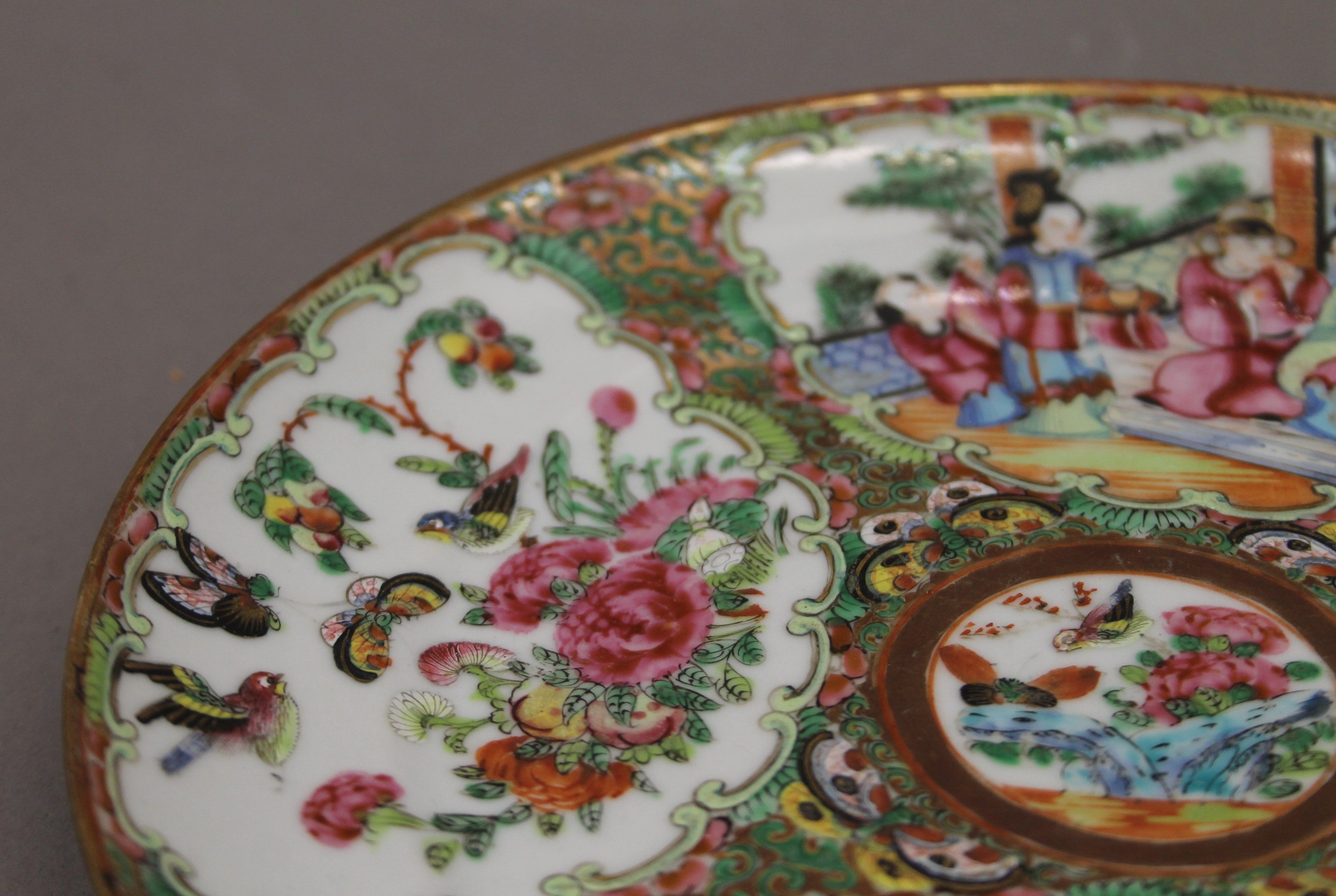 A 19th century Chinese Canton famille rose plate decorated with deities, butterflies, - Image 3 of 4