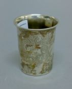 A 19th century engraved 800 silver beaker. 7.5 cm high. 51.5 grammes.