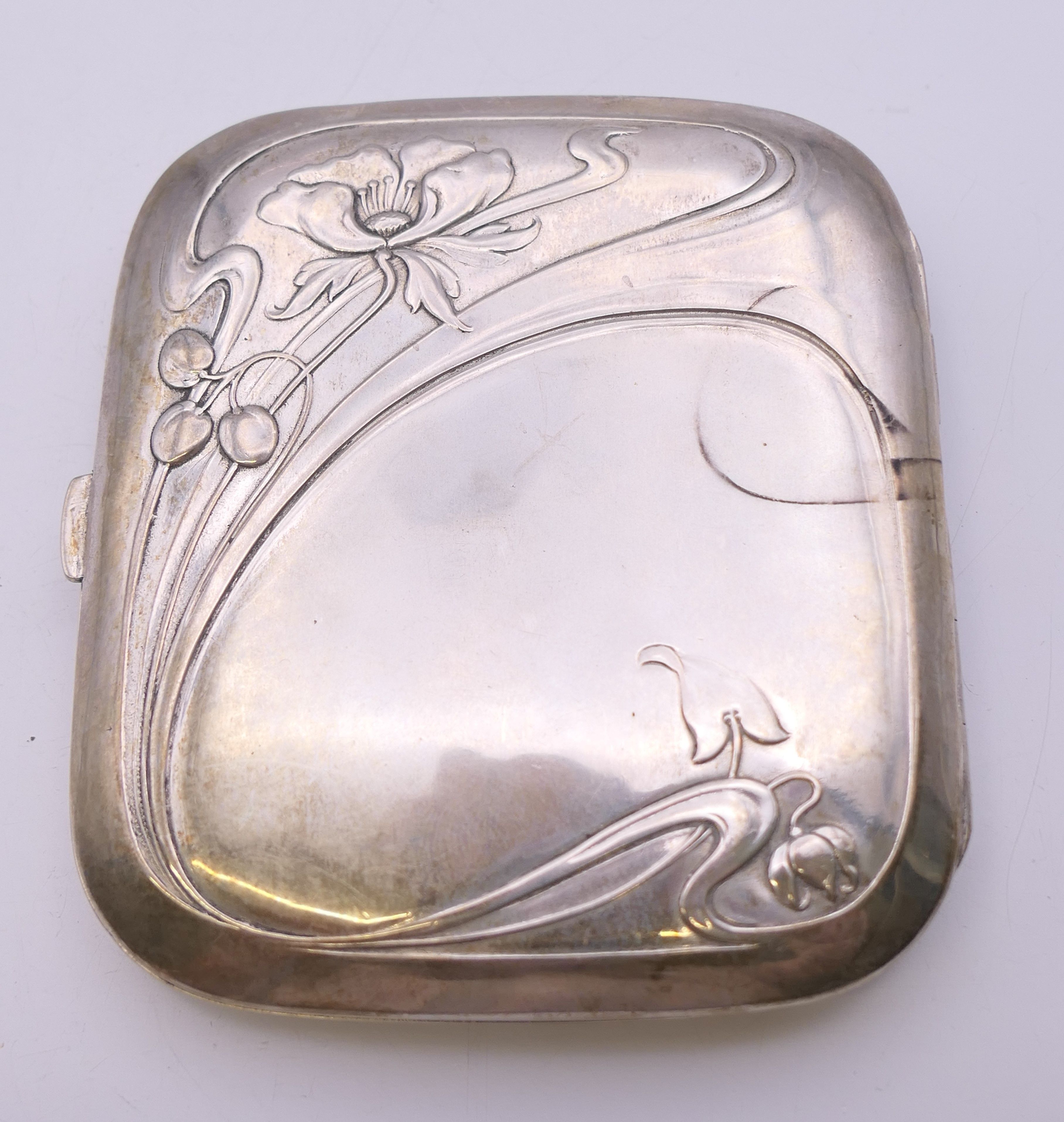 An Art Nouveau 800 silver cigarette case. 8 cm wide. 78.6 grammes total weight. - Image 3 of 8