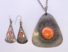 A 1970's pewter jewellery set. The pendant 6 cm high.