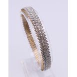A 9 ct gold diamond bracelet. Approximate total diamond weight 2 carats plus. 18.5 cm long. 20.