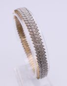 A 9 ct gold diamond bracelet. Approximate total diamond weight 2 carats plus. 18.5 cm long. 20.