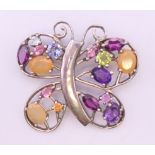 A silver gemstone butterfly pendant 4 cm wide.