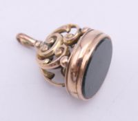 A 9 ct gold and bloodstone fob. 3 cm high. 5.8 grammes total weight.