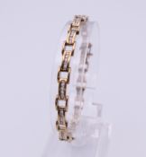A 9 ct gold diamond tennis bracelet. Approximate total diamond weight 1.02 carats. 16 cm long. 11.