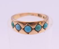 A Victorian 15 ct gold and turquoise child's ring, hallmarked for Birmingham. Ring size E. 1.