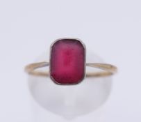 A 9 ct gold and silver paste stone set ring. Ring size O/P. 1.6 grammes total weight.