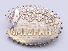 A silver Mizpah brooch. 3.5 cm wide.