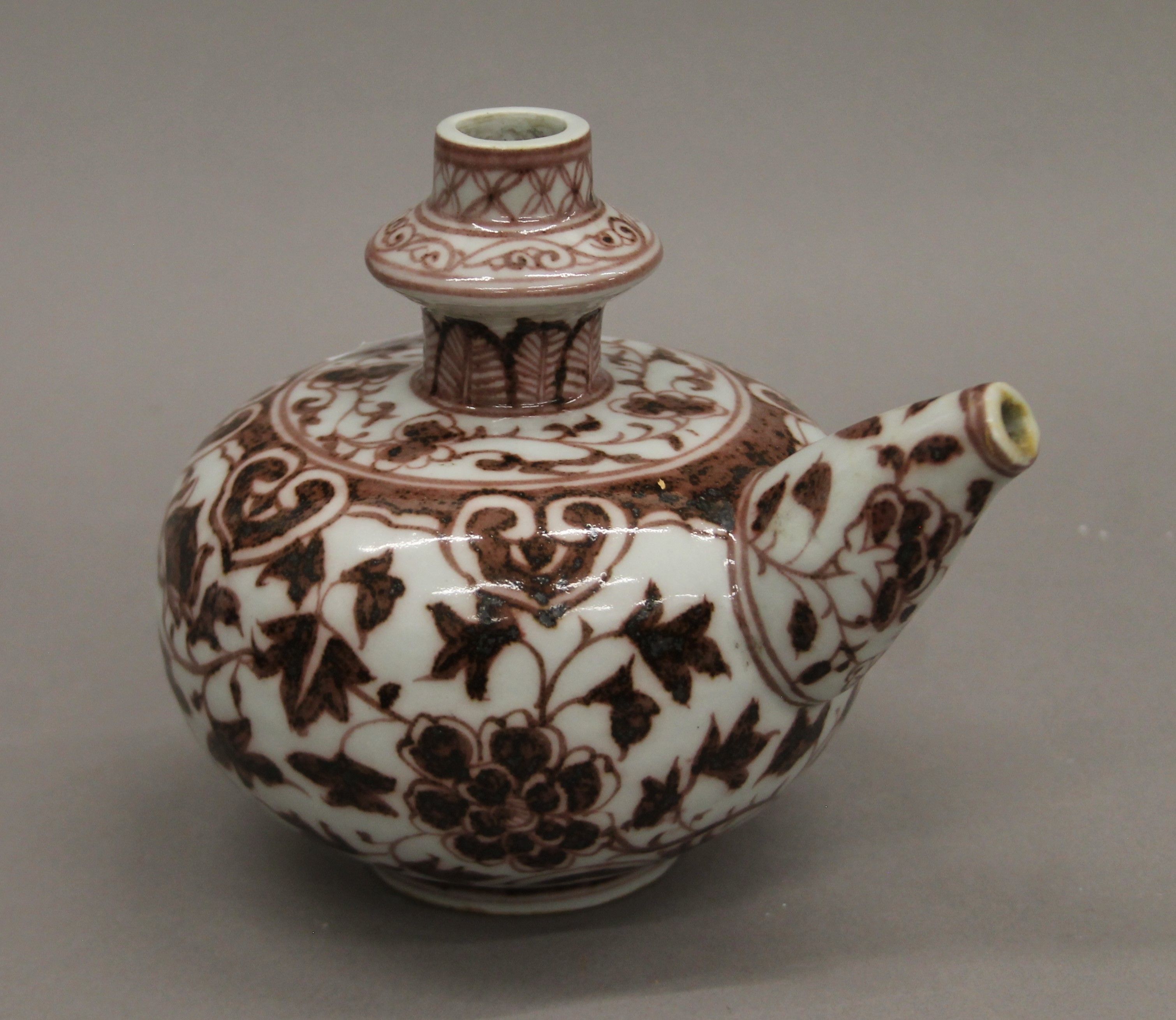 A Chinese porcelain wine ewer. 14 cm high.