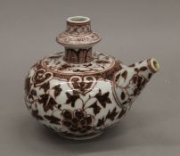 A Chinese porcelain wine ewer. 14 cm high.