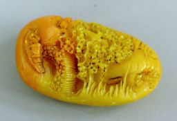 A model of a pebble carving. 9 cm high.