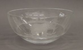 A glass bowl etched with elephants. 23 cm diameter.