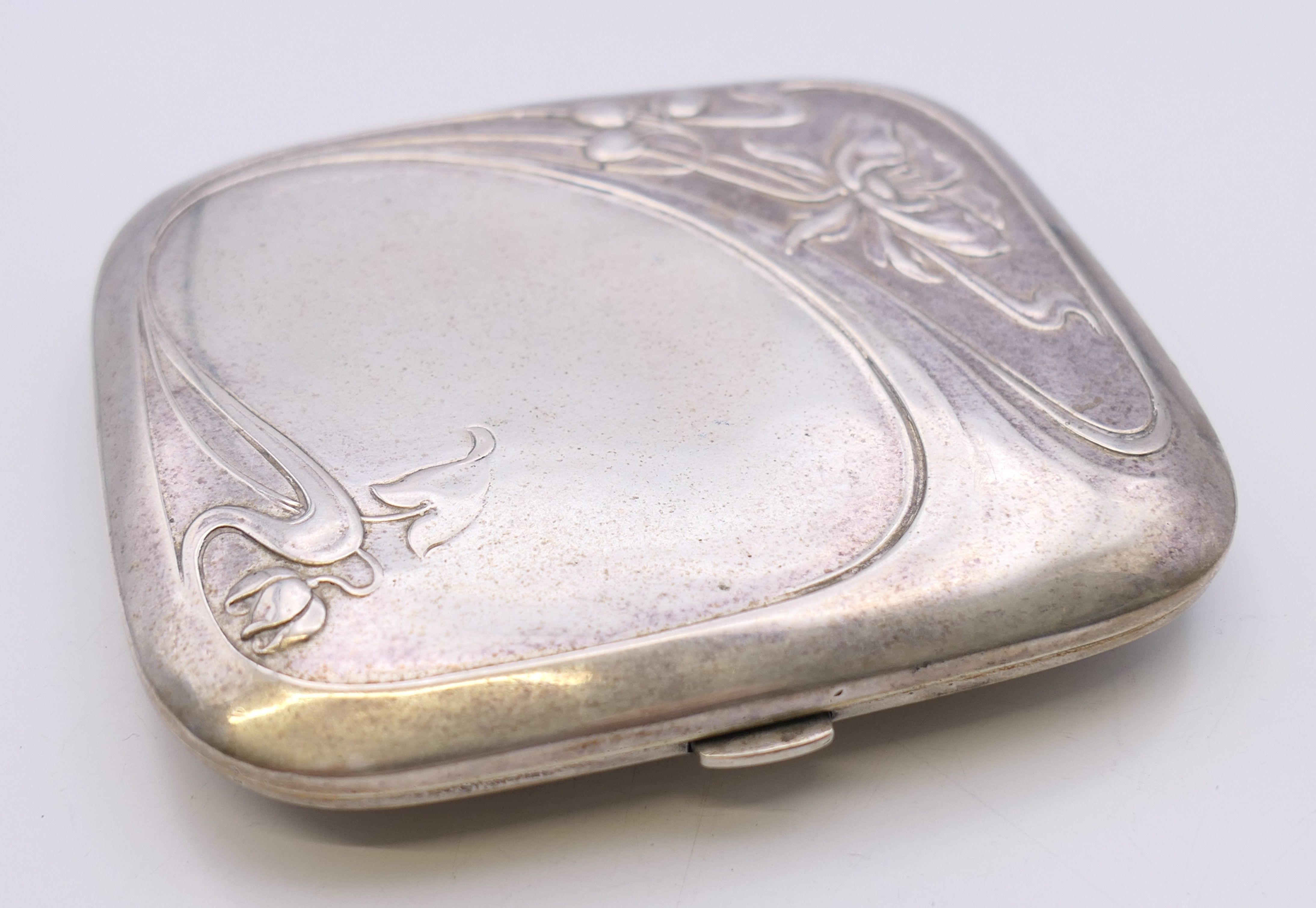 An Art Nouveau 800 silver cigarette case. 8 cm wide. 78.6 grammes total weight. - Image 4 of 8