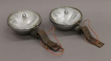 A pair of vintage Lucas car headlamps. 18 cm diameter.