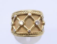 An Elizabeth Gage style 18 K gold diamond ring. Ring size M/N, 12.2 grams total weight.