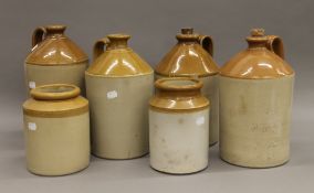 A quantity of stoneware flagons and crocks. The largest 34 cm high.