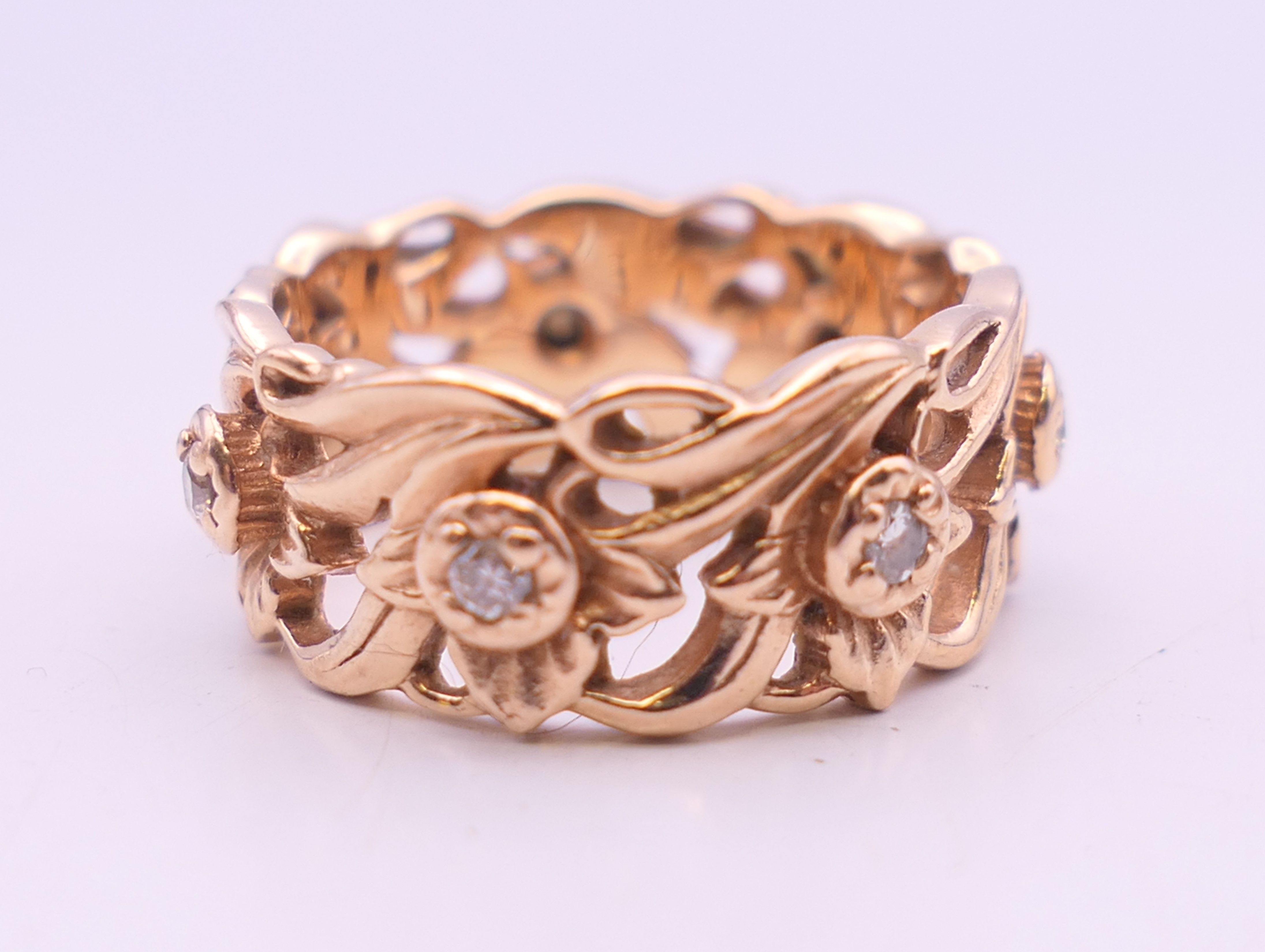 A 14 ct rose gold diamond set Welsh wedding ring. Ring size M/N. 7.9 grammes total weight.