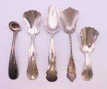 Five continental silver caddy spoons, the largest 12 cm long, 51.8 grams.