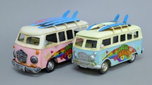 Two tin plate VW camper van models. The largest 25 cm long.