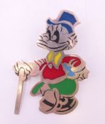 A silver Scrooge McDuck brooch. 6 cm high.