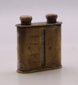 A brass/nickel pocket mechanical man and pocket director, inscribed trademark 'Robot'. 5 cm high.