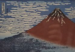 A Japanese woodcut print of Mount Fuji, framed and glazed. 17.5 x 12.5 cm.