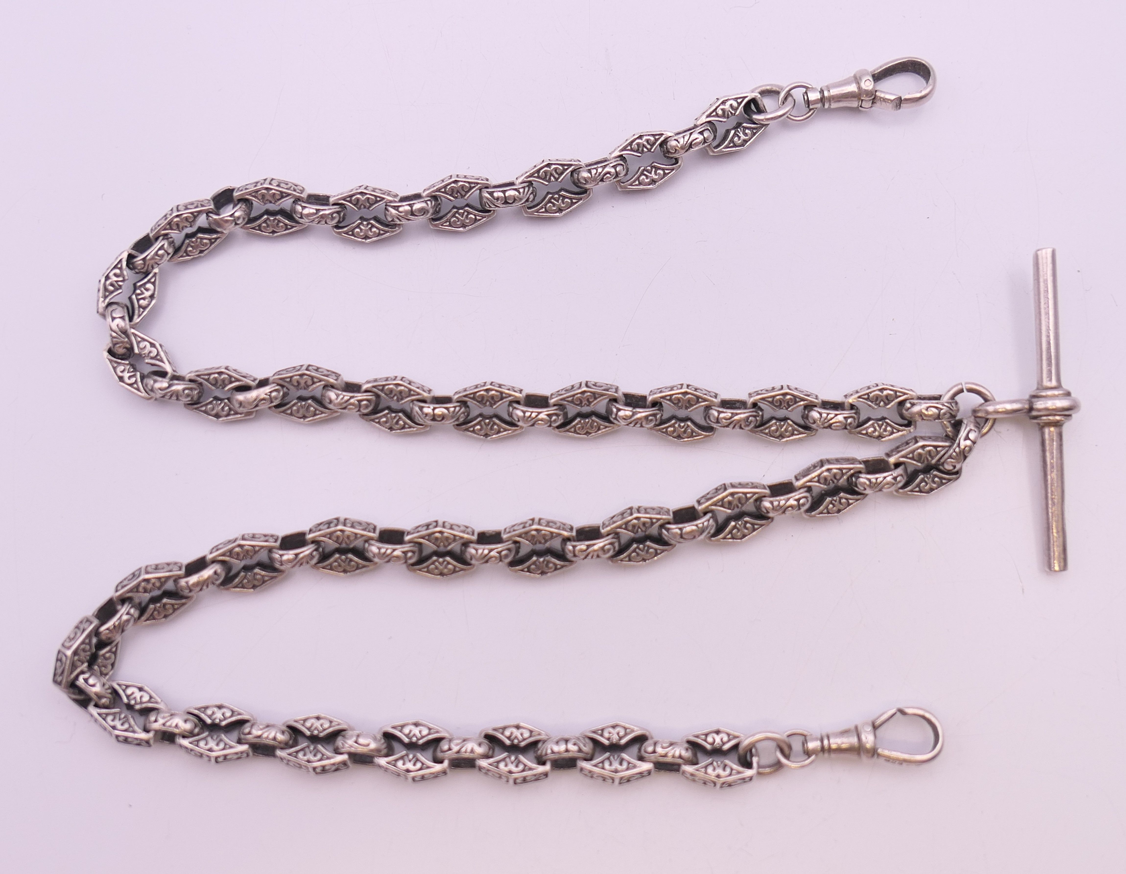 A silver watch chain with patterned links. 49 cm long. 49.1 grammes. - Image 7 of 7