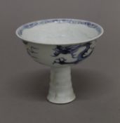 A Chinese blue and white porcelain stem cup. 12 cm diameter.