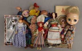 A quantity of various dolls.