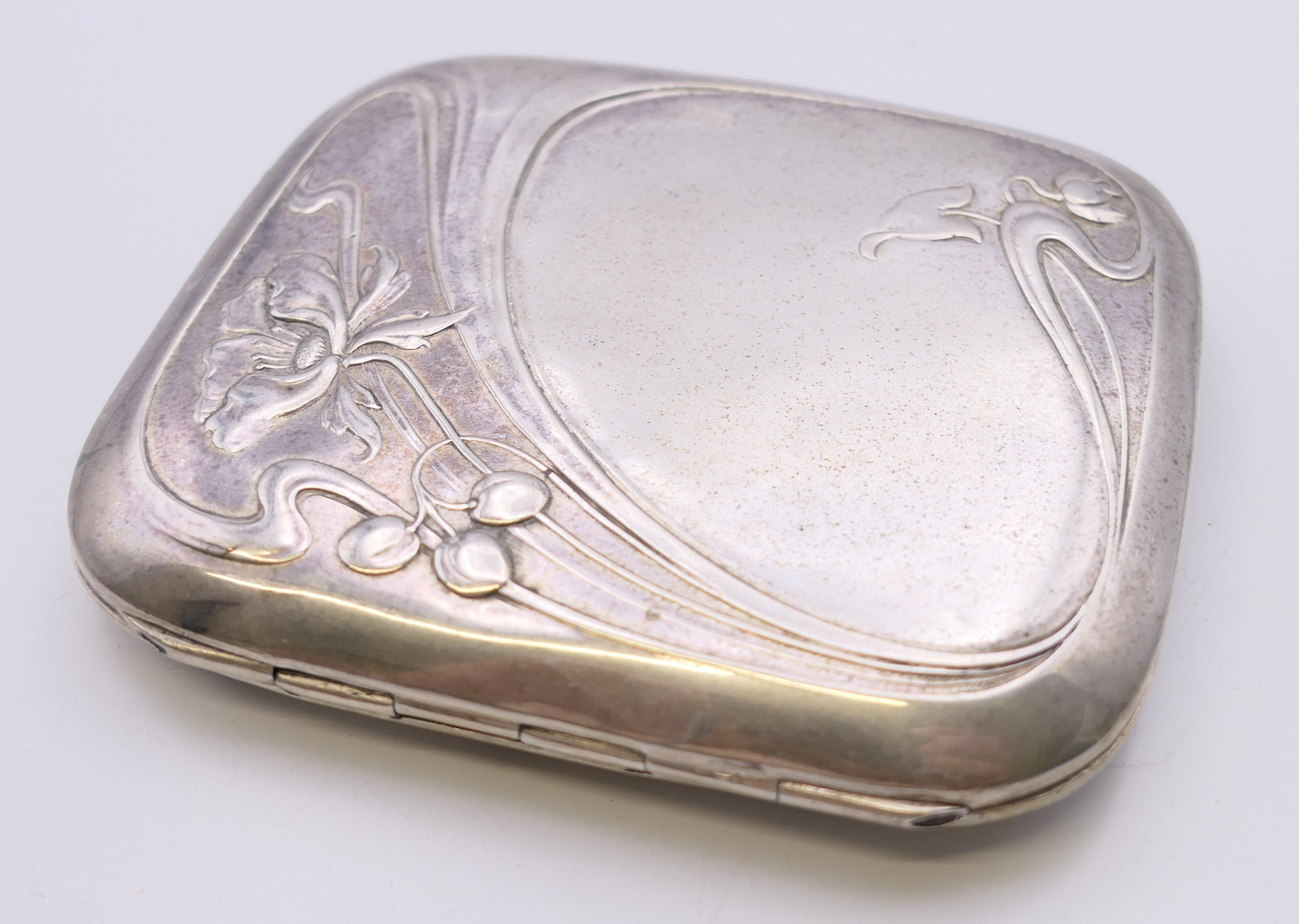An Art Nouveau 800 silver cigarette case. 8 cm wide. 78.6 grammes total weight. - Image 5 of 8