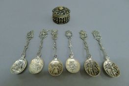A set of six Dutch unmarked silver spoons and an unmarked white metal circular box. The spoons 74.