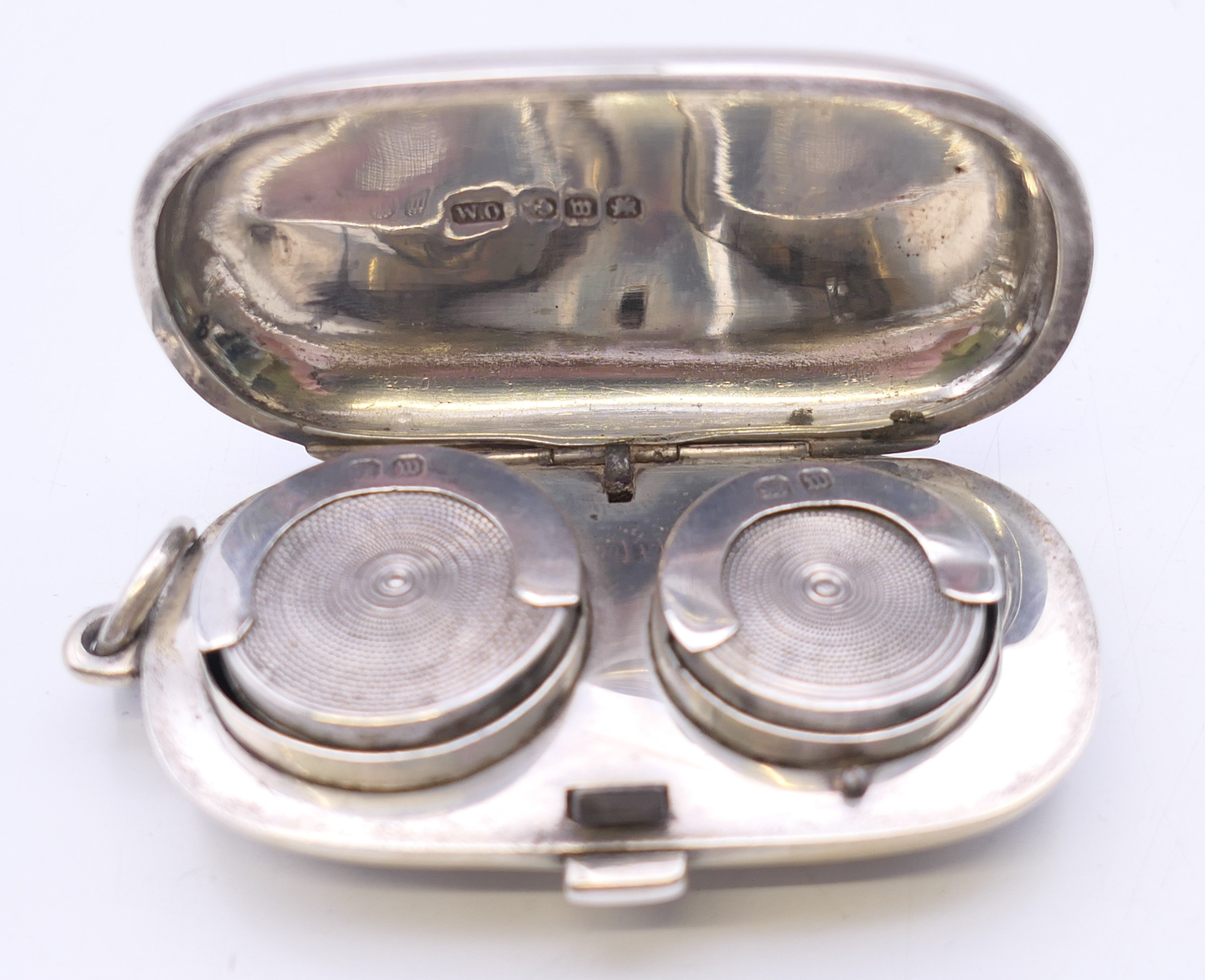 A Victorian silver sovereign case with leaf chased pattern, Birmingham 1886. 6 cm wide. 40 grammes. - Image 4 of 7
