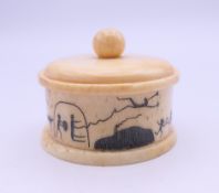 A small bone box. 4 cm diameter.