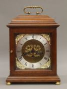 A Comitti mahogany cased mantle clock. 35 cm high.