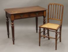 A Victorian mahogany two drawer side table and a chair. The former 91 cm wide.